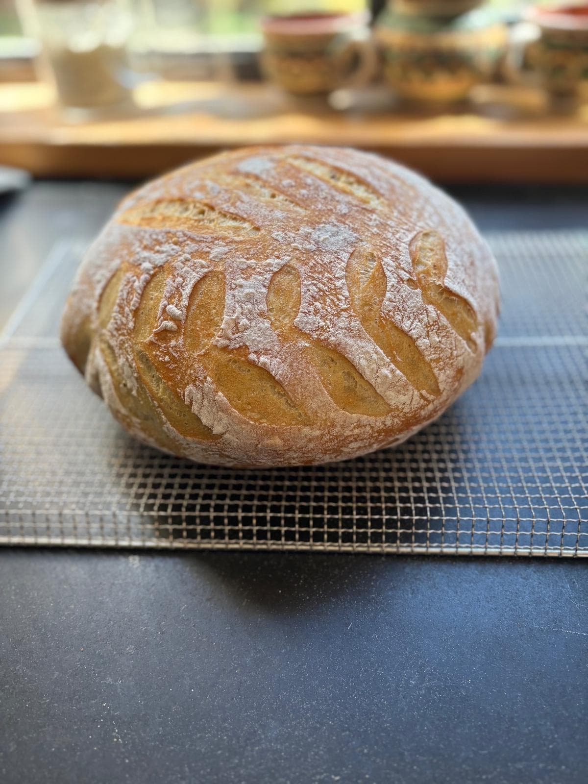 A golden round sourdough loaf